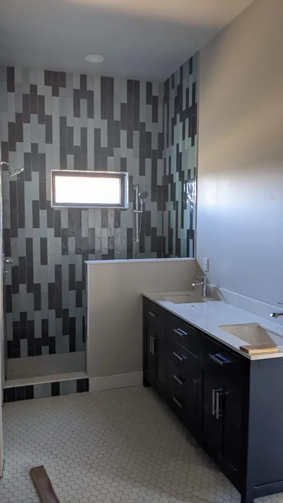 Guest bath — tile & wood vanity